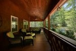 Huge covered front porch with comfy porch furniture